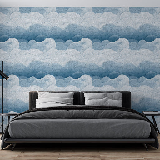 Une chambre moderne avec un papier peint représentant des nuages en dégradé de bleu, créant une atmosphère apaisante et aérienne.