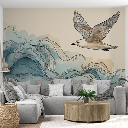 Un salon moderne avec un papier peint représentant un oiseau en vol au-dessus de vagues stylisées dans des teintes douces de bleu et beige, créant une atmosphère apaisante et aérienne.