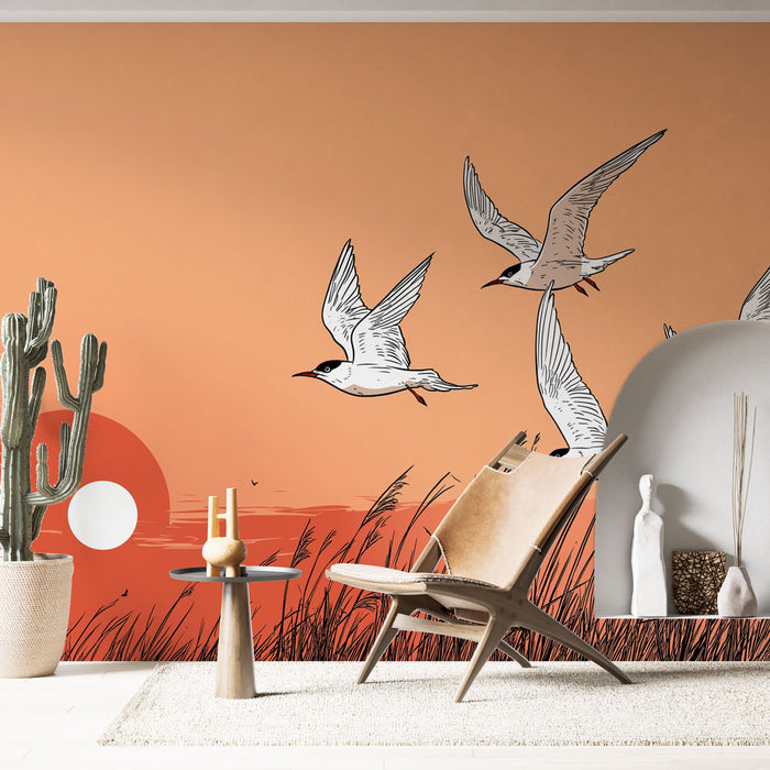 Une pièce lumineuse avec un papier peint illustrant des oiseaux en vol sur un fond orange évoquant un coucher de soleil, créant une atmosphère apaisante et naturelle.
