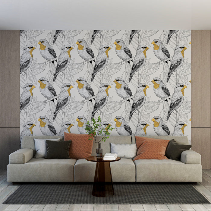Un salon moderne avec un papier peint illustrant des oiseaux stylisés en noir et jaune sur un fond clair, créant une ambiance vivante et naturelle.