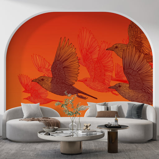 Un salon contemporain avec un papier peint vibrant orange illustrant des oiseaux en vol, créant une atmosphère dynamique et chaleureuse.