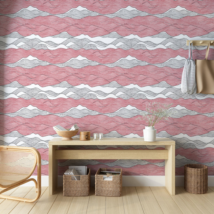 Une entrée moderne avec un papier peint aux motifs ondulés rose et gris, créant une atmosphère dynamique et chaleureuse.