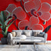 Papier peint orchidées stylisées sur fond rouge vibrant pour salon moderne