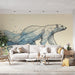 Un salon moderne avec un papier peint illustrant un ours polaire stylisé en bleu et noir, évoquant une ambiance artistique et apaisante.