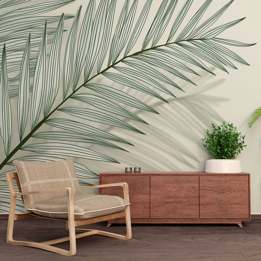 Une pièce moderne avec un papier peint représentant une grande feuille de palmier verte sur fond clair, créant une ambiance tropicale et apaisante.