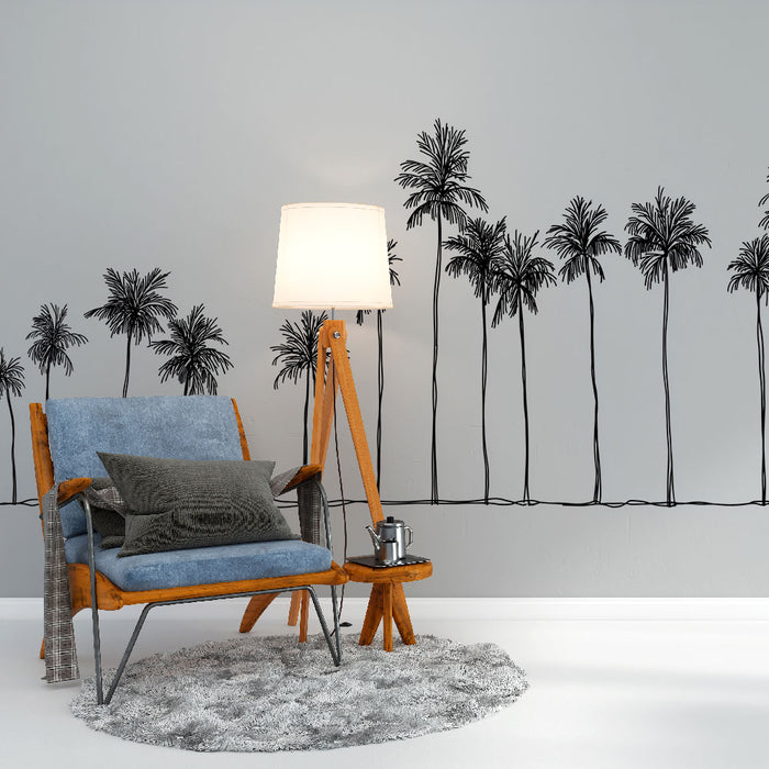 Une pièce moderne avec un papier peint représentant des palmiers stylisés en noir sur un fond gris, créant une ambiance tropicale et apaisante.