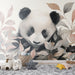 Une chambre d'enfant avec un papier peint illustrant un panda délicat entouré de feuilles pastel, créant une atmosphère douce et ludique.