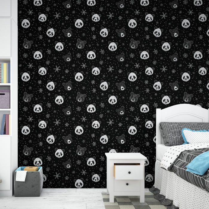 Une chambre moderne avec un papier peint noir orné de têtes de pandas et d'étoiles blanches, créant une ambiance ludique et originale.