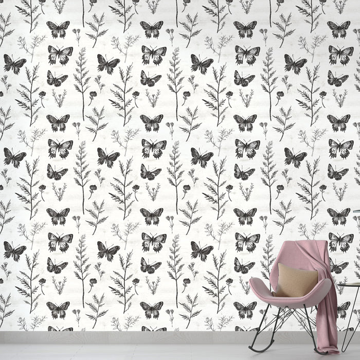 Une chambre élégante avec un papier peint noir et blanc illustrant des papillons et des plantes délicates, créant une ambiance artistique et apaisante.