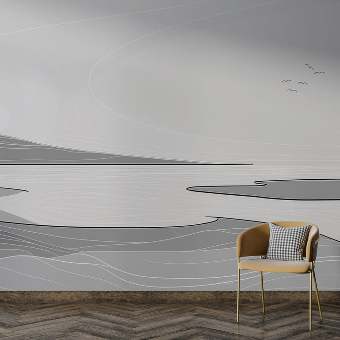 Une pièce moderne avec un papier peint abstrait en nuances de gris, représentant des formes fluides évoquant un paysage minimaliste et apaisant.