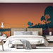 Une chambre moderne avec un papier peint représentant un paysage stylisé aux dégradés orange et violet, évoquant une ambiance sereine et poétique.