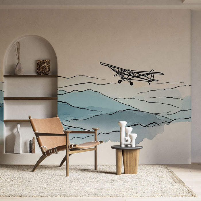 Une pièce moderne avec un papier peint représentant un paysage aérien en dégradé de bleu et un avion stylisé, créant une atmosphère apaisante et inspirante.