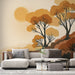 Un salon moderne avec un papier peint représentant des arbres stylisés aux teintes chaudes d'orange et de brun, créant une atmosphère chaleureuse et apaisante.