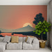 Une pièce moderne avec un papier peint représentant un paysage serein au coucher de soleil, avec des montagnes et un reflet apaisant sur l'eau.