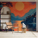 Une pièce moderne avec un papier peint représentant un paysage montagneux au coucher de soleil, aux teintes orange et bleu, créant une ambiance sereine et poétique.