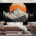 Une chambre moderne avec un papier peint représentant des montagnes majestueuses sous une lune orange éclatante, créant une ambiance mystique et apaisante.