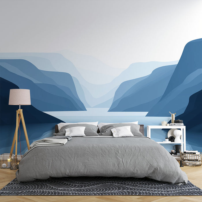 Une chambre moderne avec un papier peint représentant des montagnes en dégradés de bleu, créant une atmosphère apaisante et naturelle.