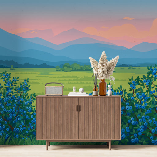 Une pièce lumineuse avec un papier peint représentant un paysage champêtre aux montagnes bleues et des buissons de baies, créant une ambiance sereine et naturelle.