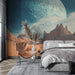 Une chambre moderne avec un papier peint représentant un paysage lunaire aux teintes bleues et orangées, créant une atmosphère à la fois futuriste et apaisante.