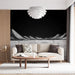 Un salon moderne avec un papier peint monochrome représentant des montagnes stylisées sur fond noir, créant une ambiance artistique et contemplative.