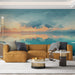 Un salon moderne avec un papier peint représentant un paysage marin abstrait aux teintes bleu et orange, créant une atmosphère apaisante et rêveuse.