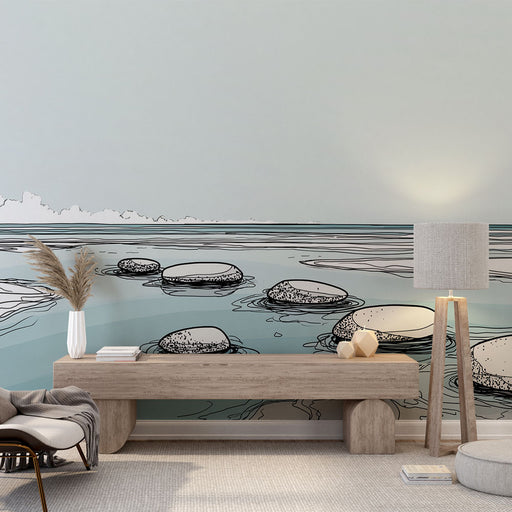 Une pièce moderne avec un papier peint illustrant des pierres sur un fond aquatique aux teintes douces, créant une atmosphère sereine et apaisante.