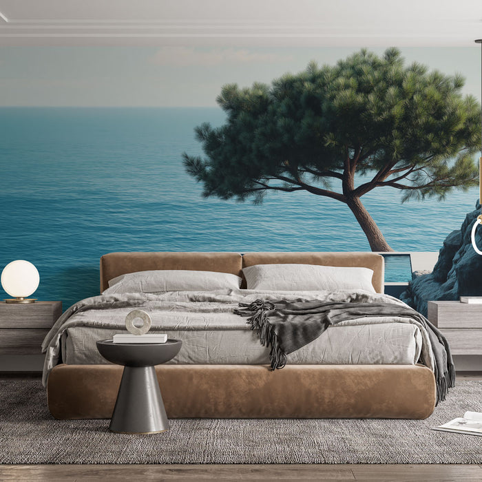 Une chambre moderne avec un papier peint représentant un paysage marin apaisant, où un arbre se détache sur un fond bleu clair évoquant la sérénité.