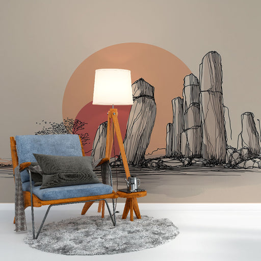 Une pièce moderne avec un papier peint illustrant des formations rocheuses stylisées sur fond de coucher de soleil, créant une atmosphère apaisante et artistique.