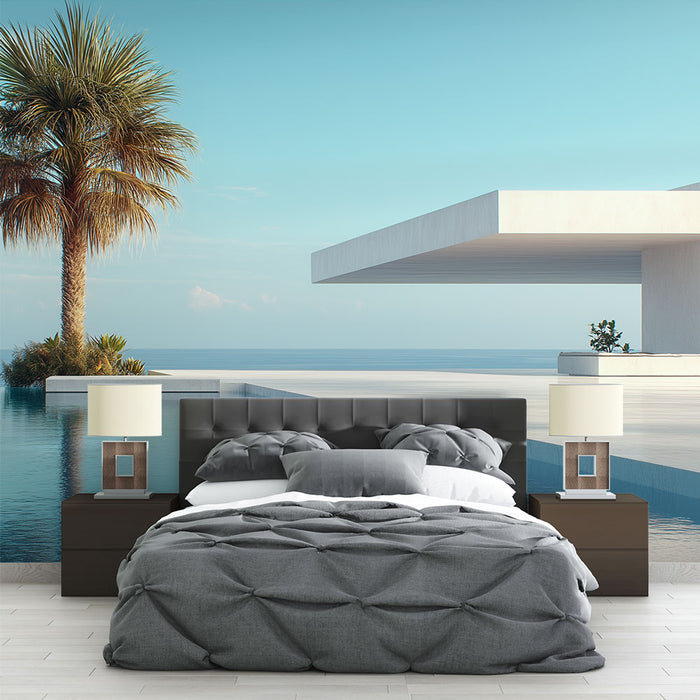 Une chambre moderne avec un papier peint représentant une vue apaisante sur la mer et un palmier, créant une ambiance relaxante et estivale.