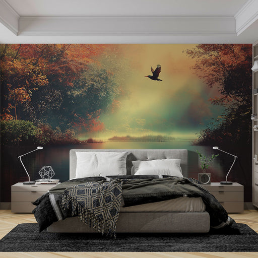 Une chambre moderne avec un papier peint représentant un paysage automnal mystique, où un oiseau s'élève au-dessus d'un lac embrumé, créant une atmosphère sereine et poétique.
