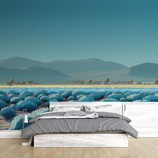 Une chambre moderne avec un papier peint illustrant un paysage de champs bleus et de collines sous un ciel clair, créant une ambiance apaisante et naturelle.