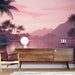 Une pièce moderne avec un papier peint tropical aux teintes roses et violettes représentant un paysage serein de palmiers et de montagnes au coucher de soleil.
