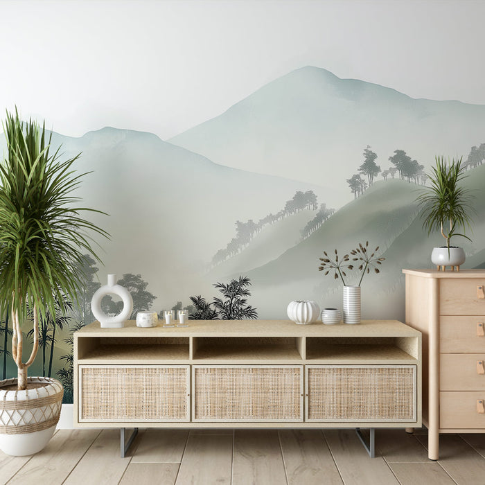 Une pièce moderne avec un papier peint représentant des montagnes brumeuses aux teintes douces de vert et de gris, créant une atmosphère apaisante et naturelle.