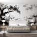 Une chambre moderne avec un papier peint monochrome représentant un paysage stylisé de branches et de montagnes, créant une atmosphère apaisante et artistique.