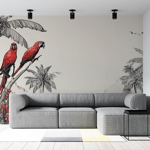 Un salon moderne avec un papier peint tropical illustrant des perroquets rouges sur fond clair, créant une ambiance vivante et exotique.