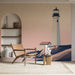 Papier peint mural avec phare majestueux sur une côte sereine pour salon moderne.
