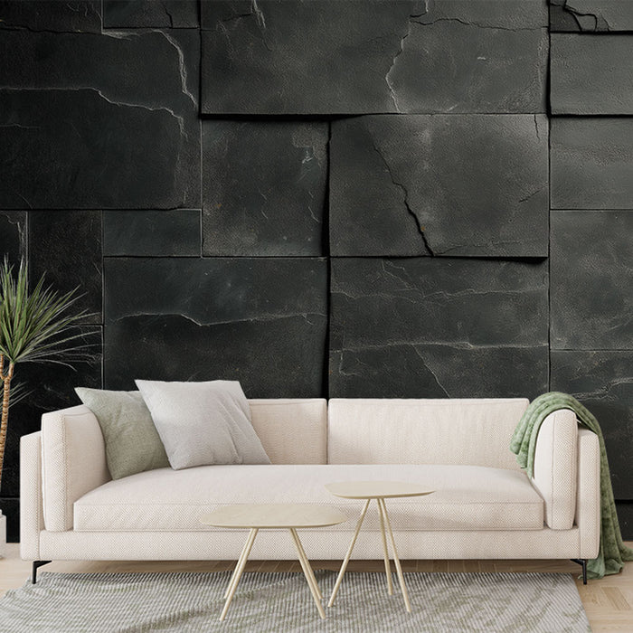 Une pièce moderne avec un papier peint texturé noir imitant des plaques de pierre, créant une atmosphère élégante et contemporaine.