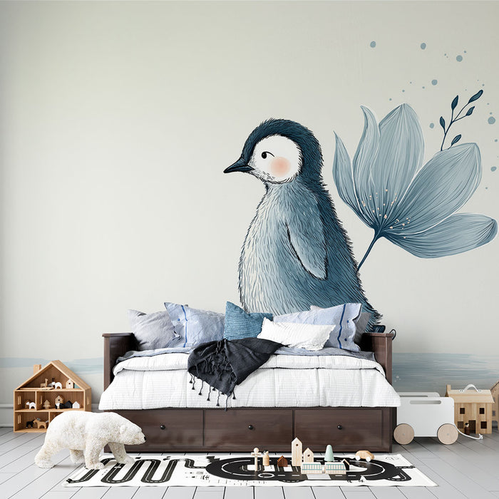 Une chambre d'enfant avec un papier peint illustrant un pingouin stylisé aux teintes douces de bleu, créant une atmosphère ludique et apaisante.