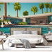 Une chambre moderne avec un papier peint représentant une villa ensoleillée, entourée de palmiers et d'une piscine, évoquant une atmosphère estivale et relaxante.