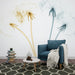 Papier peint design élégant avec fleurs de pissenlit en dégradé pour salon moderne