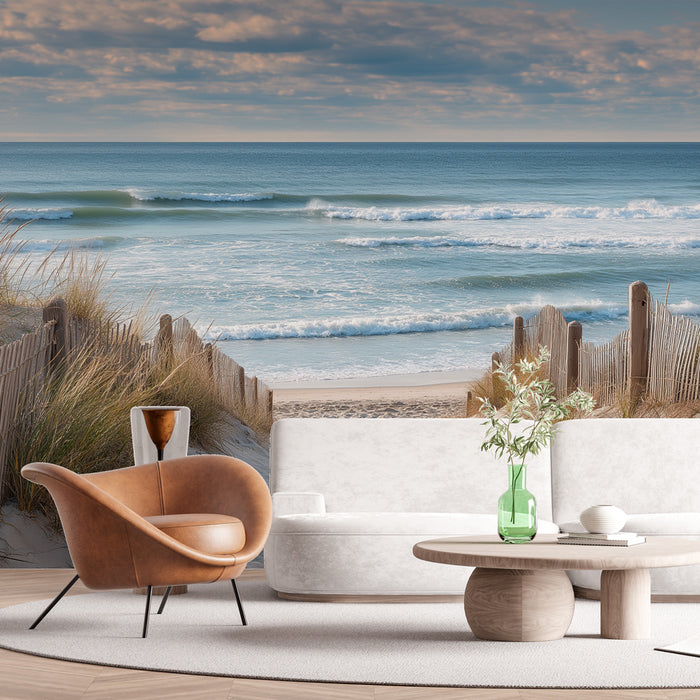 Un salon moderne avec un papier peint représentant une plage sereine, des vagues douces et un ciel nuageux, créant une atmosphère apaisante et estivale.