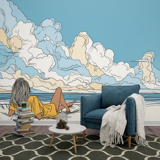 Une pièce de vie moderne avec un papier peint illustratif représentant une femme contemplant un paysage marin sous un ciel bleu, dégageant une atmosphère sereine et relaxante.