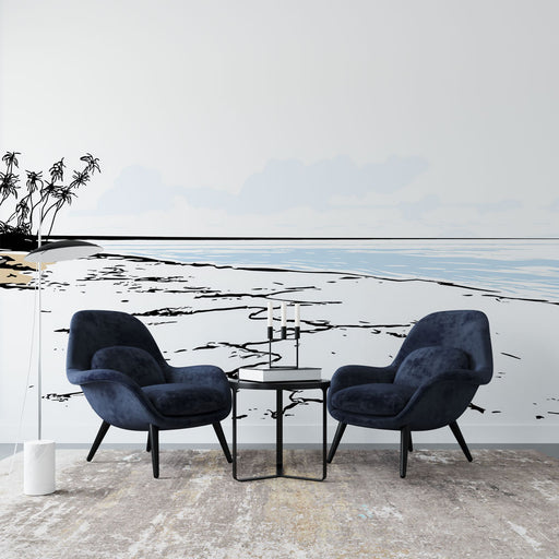 Un salon contemporain avec un papier peint représentant une plage stylisée en noir et blanc, évoquant une atmosphère apaisante et minimaliste.