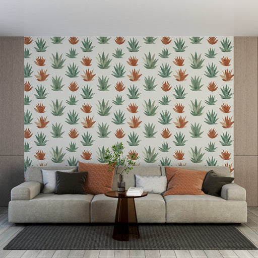 Un salon moderne avec un papier peint végétal aux motifs de plantes vertes et terracotta sur fond clair, créant une atmosphère chaleureuse et naturelle.