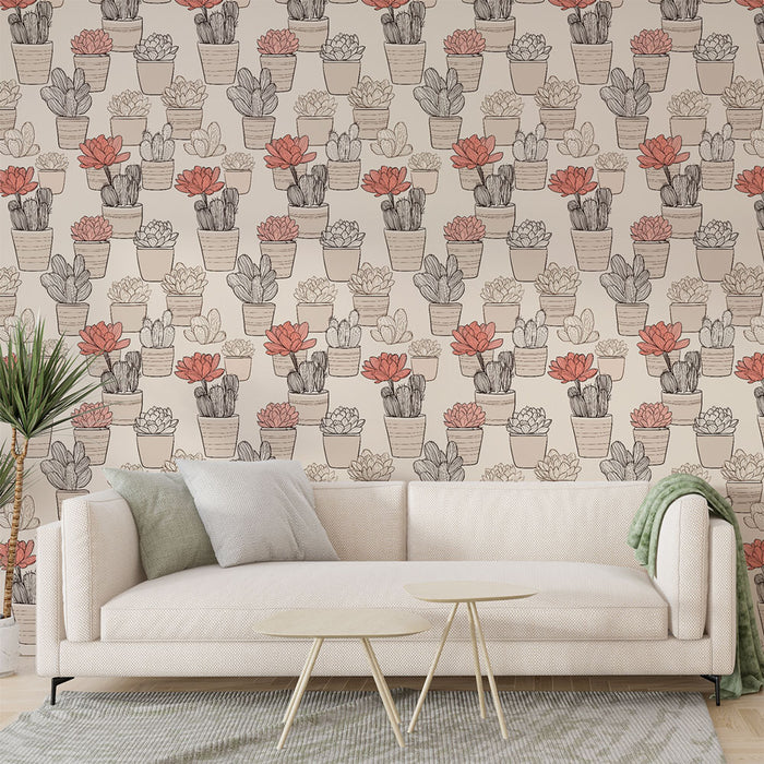 Un salon lumineux avec un papier peint illustrant des pots de plantes succulentes aux teintes douces et chaleureuses, créant une ambiance naturelle et accueillante.