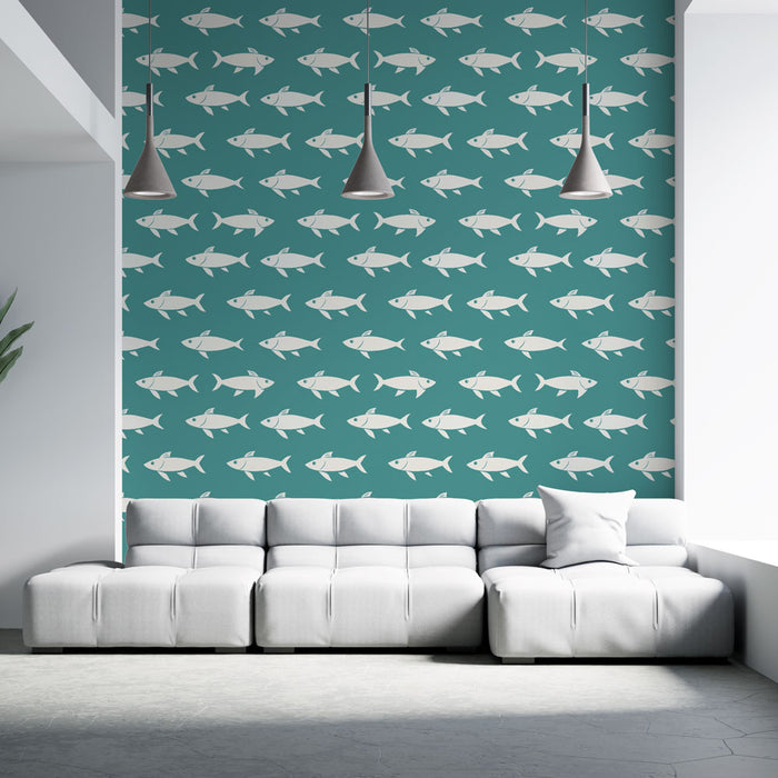 Un salon moderne avec un papier peint turquoise orné de motifs de poissons blancs, créant une ambiance marine et rafraîchissante.