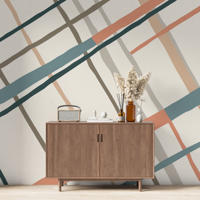 Une pièce moderne avec un papier peint aux lignes graphiques dans des teintes de bleu, rose et beige, créant une ambiance dynamique et contemporaine.