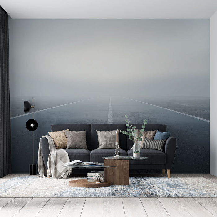 Une pièce moderne avec un papier peint représentant une route brumeuse et minimaliste, créant une atmosphère mystérieuse et apaisante.