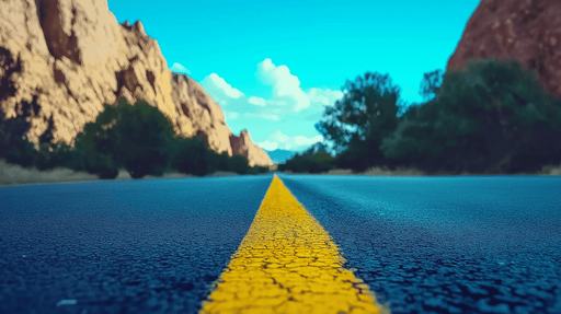 Papier peint route Une route panoramique entre montagnes et ciel bleu