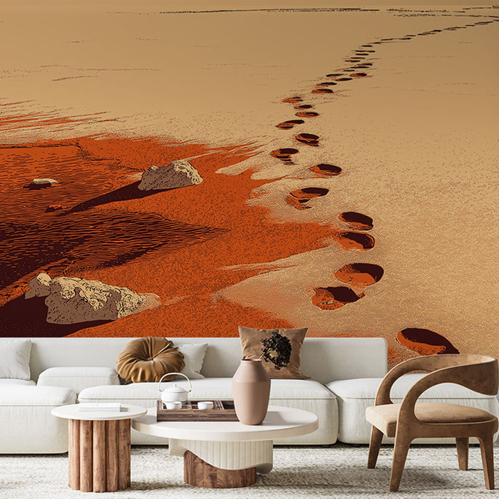 Un salon contemporain avec un papier peint représentant des empreintes de pas sur une plage aux teintes ocres et rouges, évoquant une atmosphère chaleureuse et méditative.